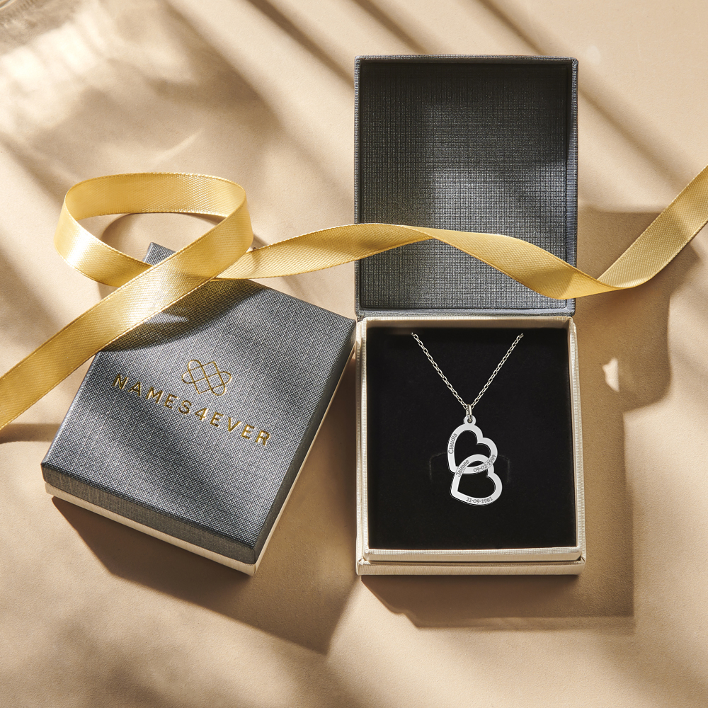 Sterling silver pendant with two linked hearts and engraving